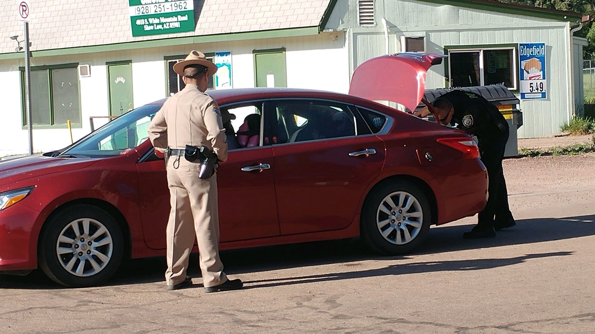 Police searching for shooting suspect-Searching cars